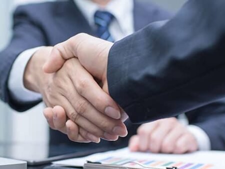 deal agreement handshake partnership news